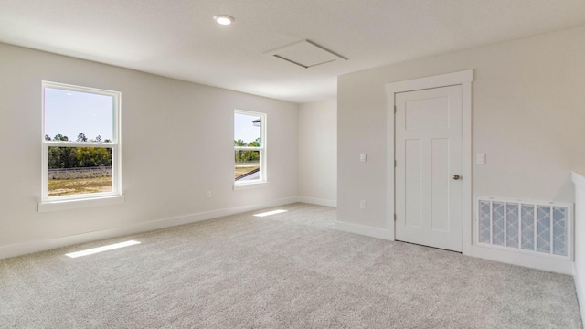 3068 Heritage Plantation Blvd, Laurel Hill, FL 32567 - empty room with baseboards, carpet, attic access, and visible vents