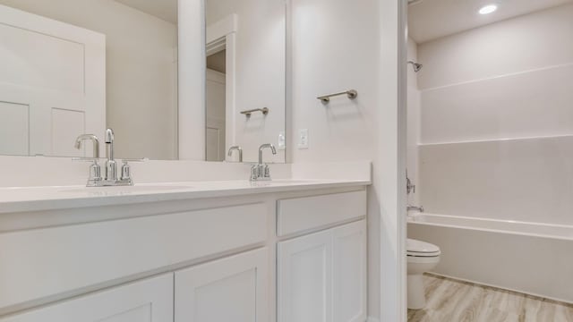 3068 Heritage Plantation Blvd, Laurel Hill, FL 32567 - bathroom featuring a sink, toilet, double vanity, and tub / shower combination