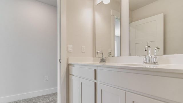 3068 Heritage Plantation Blvd, Laurel Hill, FL 32567 - bathroom featuring a sink, baseboards, and double vanity