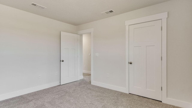 3068 Heritage Plantation Blvd, Laurel Hill, FL 32567 - unfurnished bedroom featuring baseboards, light colored carpet, and visible vents