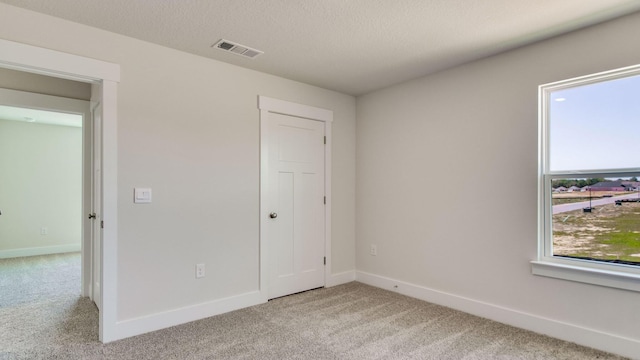 3068 Heritage Plantation Blvd, Laurel Hill, FL 32567 - unfurnished bedroom featuring visible vents, baseboards, and light colored carpet