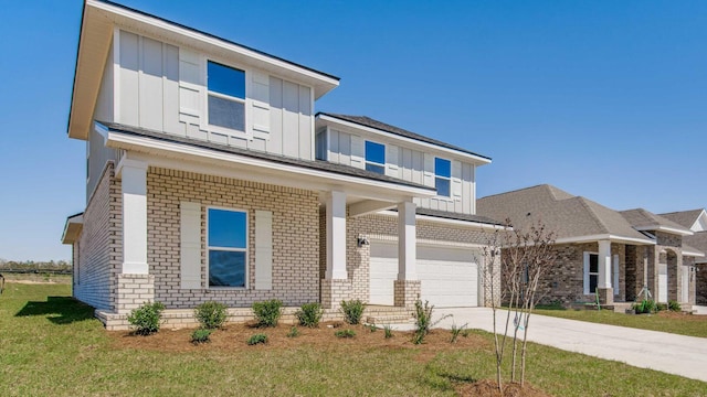 3068 Heritage Plantation Blvd, Laurel Hill, FL 32567 - view of front of house featuring a front lawn, brick siding, a garage, board and batten siding, and driveway