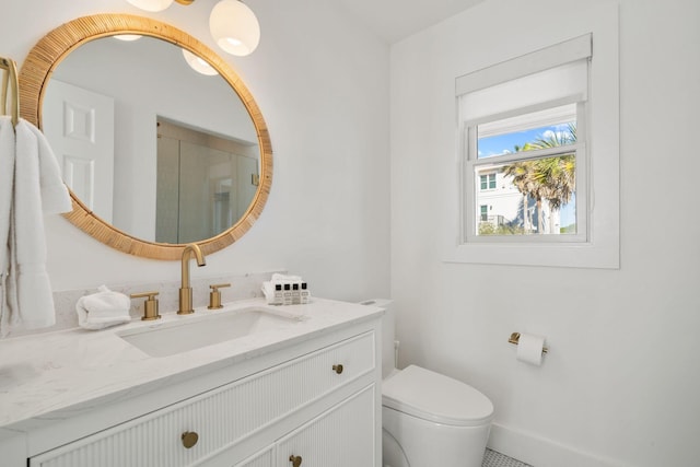 full bathroom with an enclosed shower, toilet, and vanity