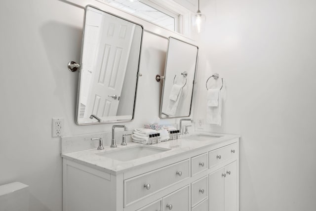 bathroom featuring double vanity and a sink