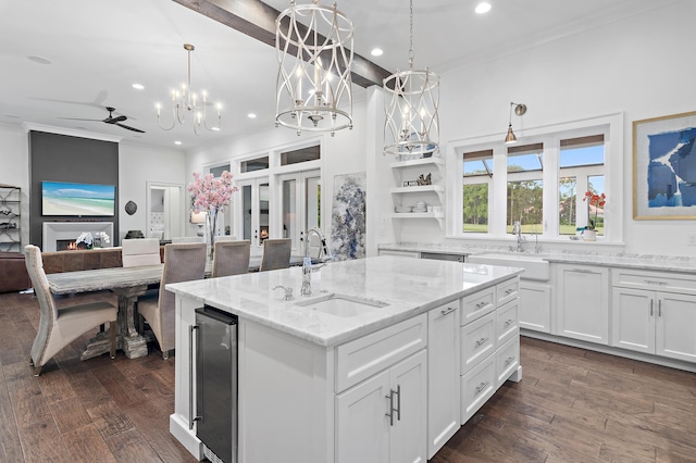 489 Regatta Bay Blvd, Destin, FL 32541 - kitchen with a sink, crown molding, recessed lighting, white cabinets, and a center island with sink