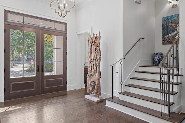 489 Regatta Bay Blvd, Destin, FL 32541 - entryway with french doors, wood finished floors, a chandelier, and baseboards