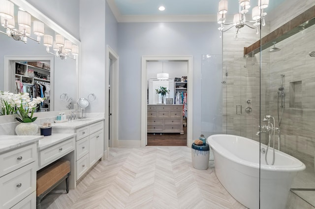 489 Regatta Bay Blvd, Destin, FL 32541 - bathroom with a stall shower, vanity, a freestanding tub, a chandelier, and a spacious closet
