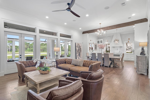 489 Regatta Bay Blvd, Destin, FL 32541 - living room featuring beamed ceiling, healthy amount of natural light, a chandelier, light wood-type flooring, and recessed lighting