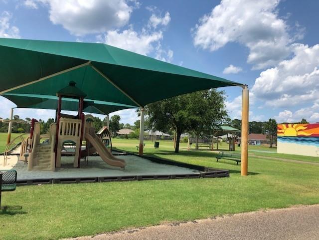 community play area with a lawn