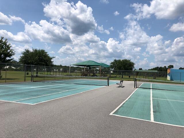 view of tennis court with fence