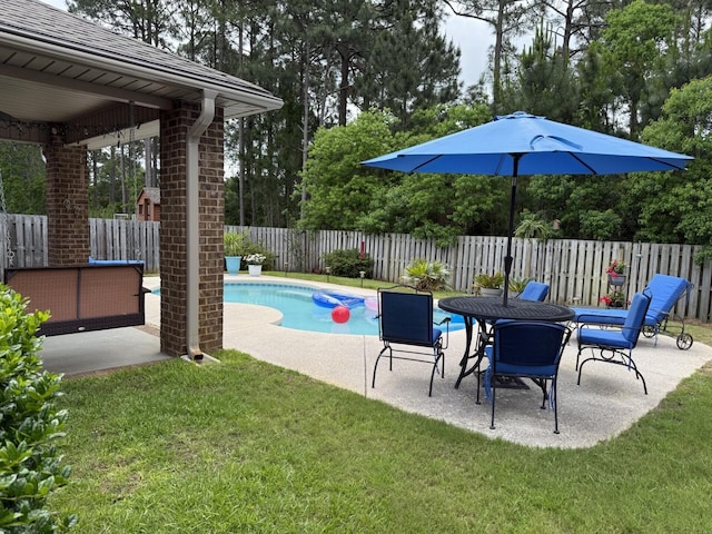 view of pool with a lawn, a fenced in pool, a fenced backyard, and a patio
