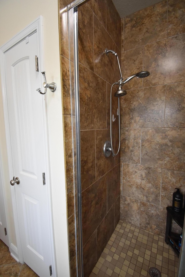 bathroom featuring a shower stall