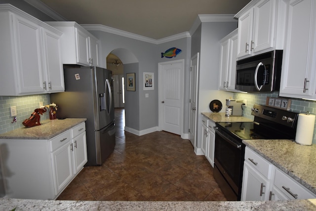 kitchen with ornamental molding, tasteful backsplash, white cabinets, and stainless steel appliances