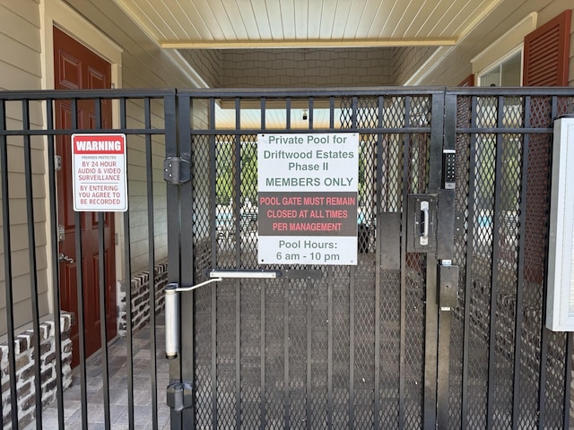 exterior details featuring a gate and fence