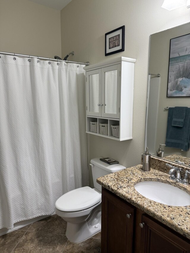 bathroom with vanity, a shower with curtain, and toilet