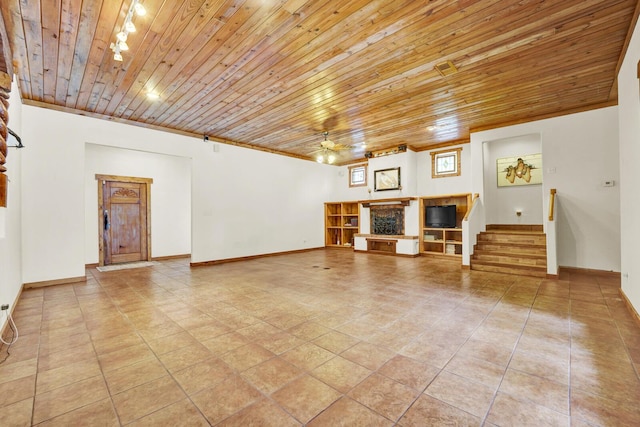 35 Blue Bayou Dr, Santa Rosa Beach, FL 32459 - unfurnished living room with a ceiling fan, wood ceiling, stairs, baseboards, and a fireplace with raised hearth