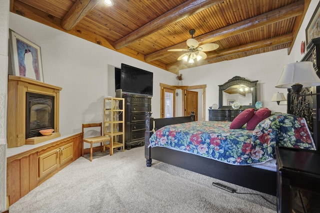 35 Blue Bayou Dr, Santa Rosa Beach, FL 32459 - carpeted bedroom with wood ceiling with exposed beams, a glass covered fireplace, and ceiling fan