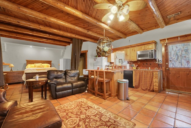35 Blue Bayou Dr, Santa Rosa Beach, FL 32459 - living area featuring a ceiling fan, light tile patterned floors, and wooden ceiling with exposed beams