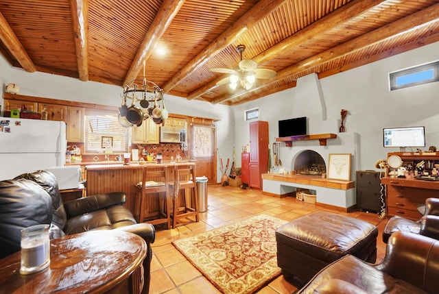 35 Blue Bayou Dr, Santa Rosa Beach, FL 32459 - living room with light tile patterned flooring, wooden ceiling with exposed beams, and a ceiling fan
