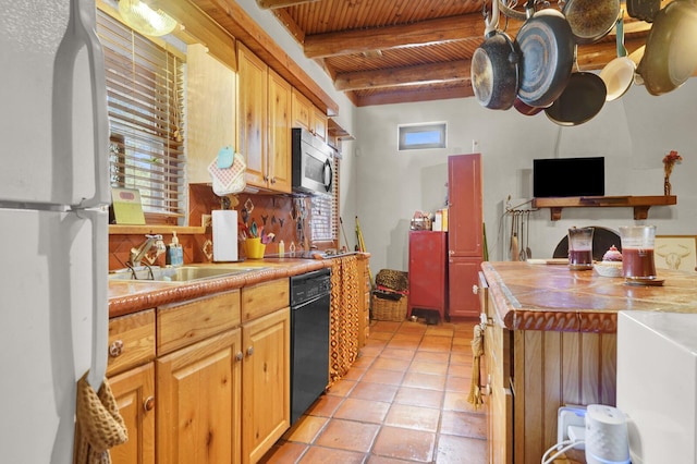 35 Blue Bayou Dr, Santa Rosa Beach, FL 32459 - kitchen featuring freestanding refrigerator, stainless steel microwave, dishwasher, healthy amount of natural light, and wood ceiling with exposed beams