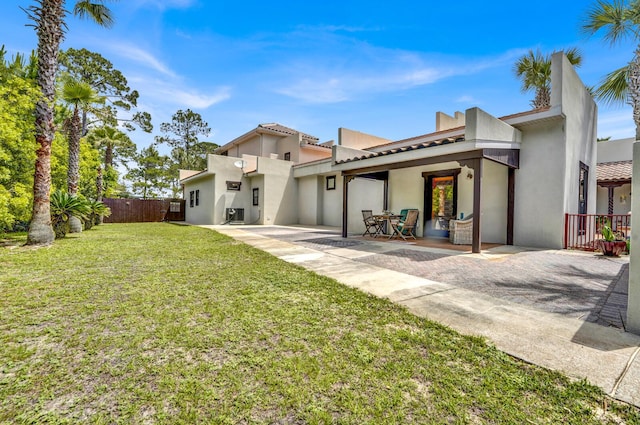35 Blue Bayou Dr, Santa Rosa Beach, FL 32459 - back of house featuring stucco siding and a patio area