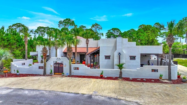 35 Blue Bayou Dr, Santa Rosa Beach, FL 32459 - view of front of property featuring a fenced front yard and stucco siding