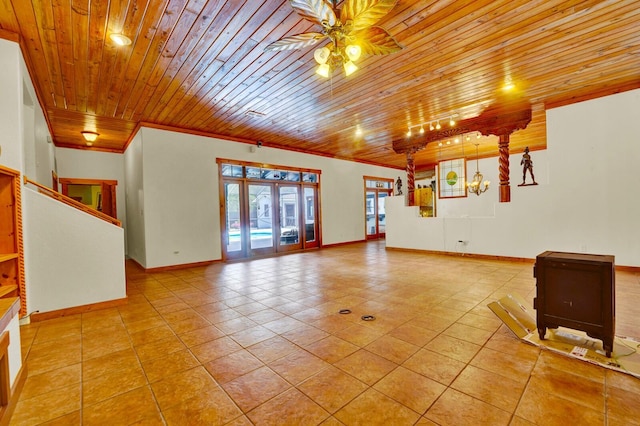 35 Blue Bayou Dr, Santa Rosa Beach, FL 32459 - unfurnished living room with a ceiling fan, wood ceiling, tile patterned flooring, baseboards, and ornamental molding