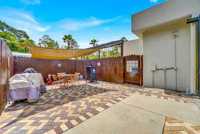 35 Blue Bayou Dr, Santa Rosa Beach, FL 32459 - fenced backyard with a patio, outdoor dining space, and grilling area