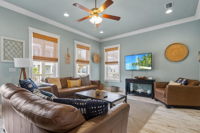 living area with ceiling fan, ornamental molding, light wood finished floors, and recessed lighting