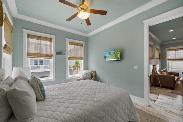 bedroom featuring wood finished floors, crown molding, a ceiling fan, recessed lighting, and baseboards