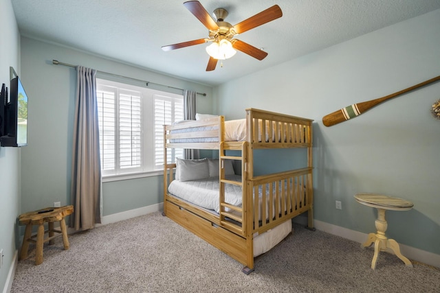 bedroom with carpet, baseboards, and a ceiling fan