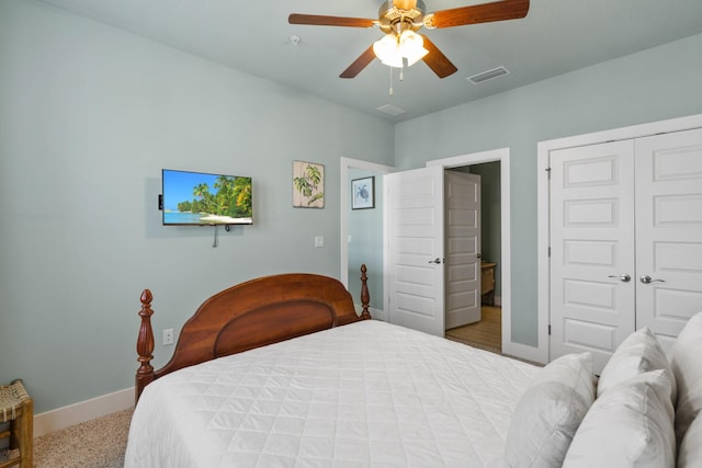 bedroom featuring baseboards, ceiling fan, and a closet