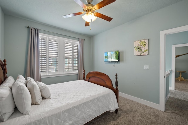 bedroom with carpet, baseboards, and ceiling fan