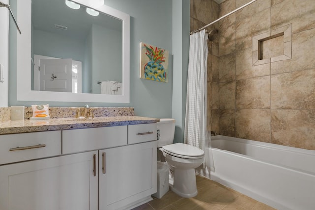 bathroom with toilet, shower / bath combo, and vanity