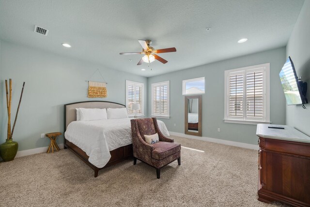 bedroom featuring light carpet, baseboards, recessed lighting, and a ceiling fan
