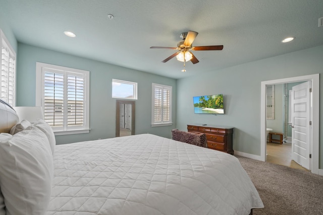 bedroom with carpet, recessed lighting, baseboards, ceiling fan, and ensuite bathroom