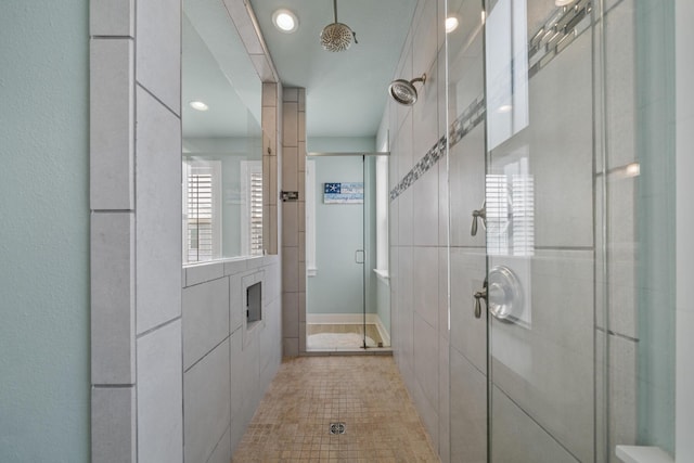 bathroom featuring a stall shower and recessed lighting