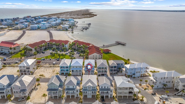aerial perspective of suburban area featuring a nearby body of water