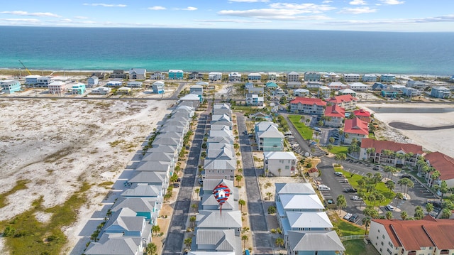 aerial view of residential area with expansive beach