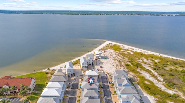 aerial perspective of suburban area featuring a nearby body of water