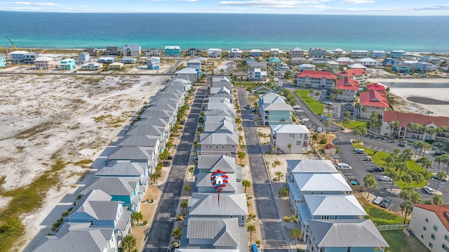 aerial perspective of suburban area with a nearby body of water