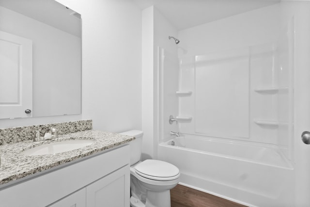 full bathroom with shower / bath combination, vanity, toilet, and wood finished floors