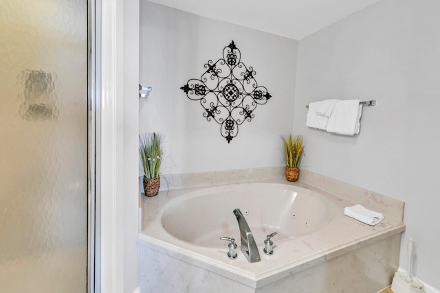 full bath with a whirlpool tub