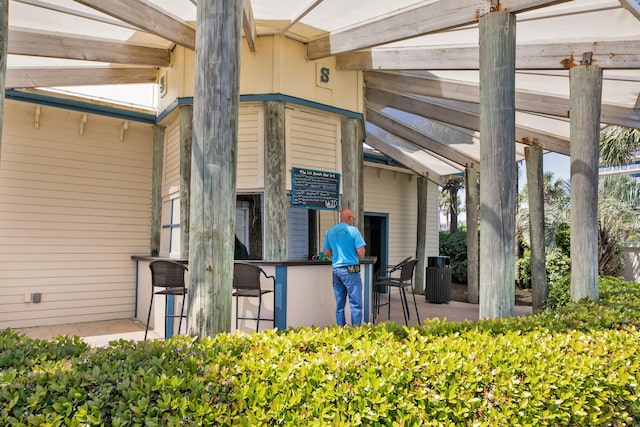 doorway to property with outdoor dry bar