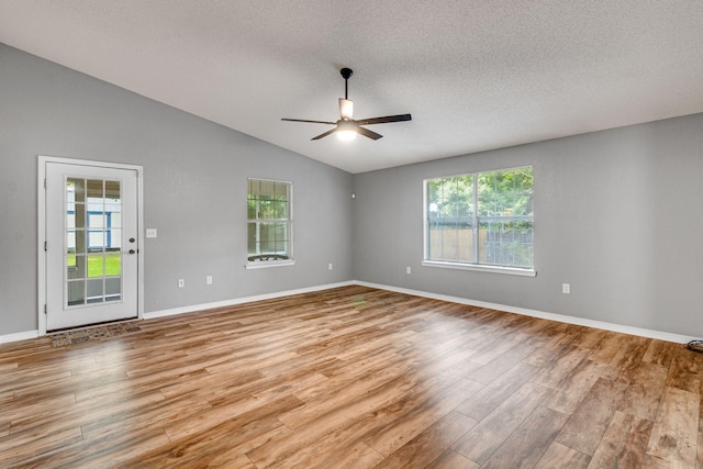 960 Valley Rd, Crestview, FL 32539 - spare room featuring wood finished floors, vaulted ceiling, and a wealth of natural light