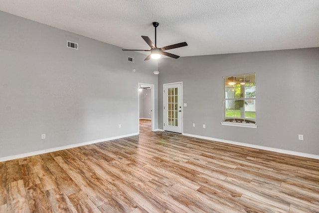 960 Valley Rd, Crestview, FL 32539 - unfurnished room featuring a ceiling fan, visible vents, vaulted ceiling, wood finished floors, and baseboards