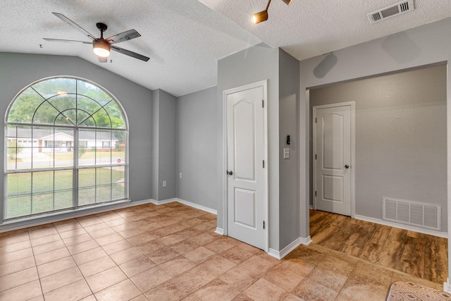 960 Valley Rd, Crestview, FL 32539 - interior space featuring a textured ceiling, visible vents, ceiling fan, and vaulted ceiling