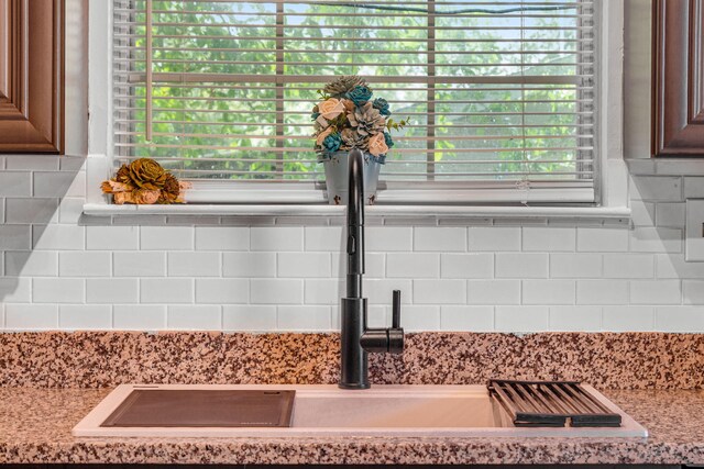 960 Valley Rd, Crestview, FL 32539 - room details with a sink, light stone countertops, and tasteful backsplash
