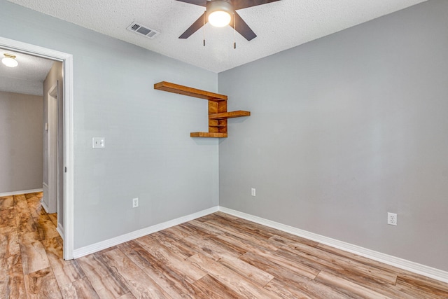 960 Valley Rd, Crestview, FL 32539 - unfurnished room with ceiling fan, a textured ceiling, visible vents, light wood-type flooring, and baseboards