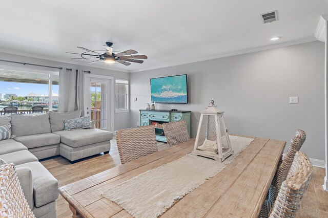 169 Durango Rd, Destin, FL 32541 - living area with visible vents, ornamental molding, ceiling fan, a water view, and light wood finished floors
